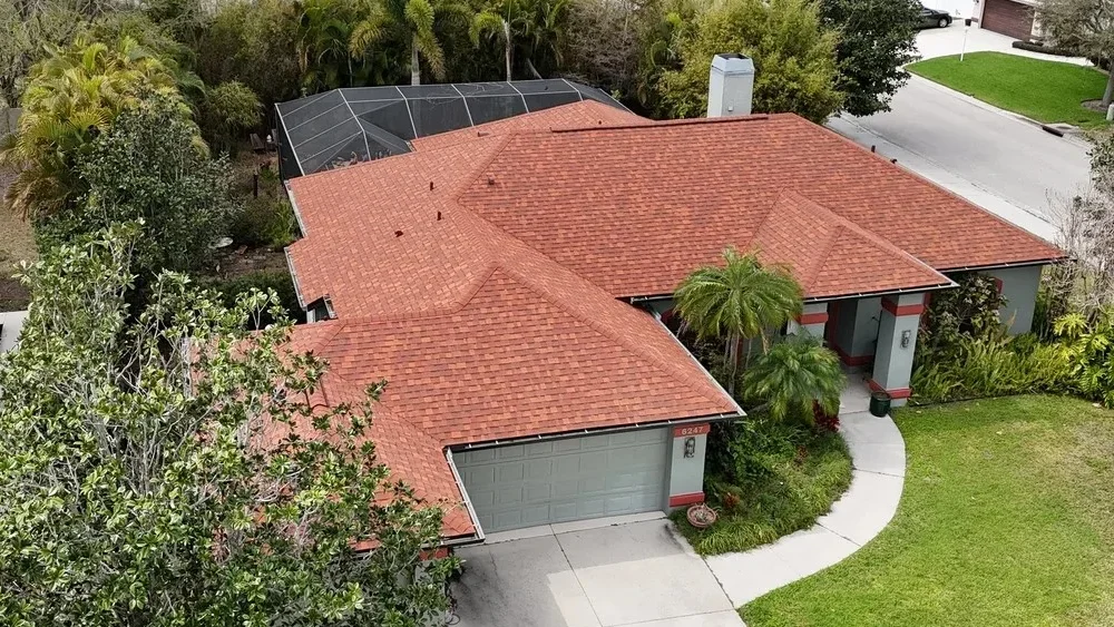 New red shingle roof installed by Barrier Builders, a trusted local roofing contractor serving residential homes in Southwest Florida.
